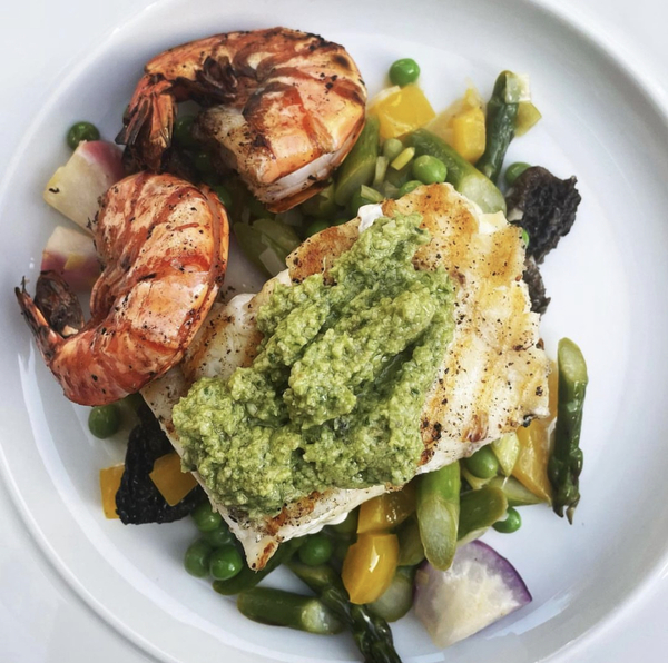 halibut with garlic scape pesto, prawns and vegetable friccasse
